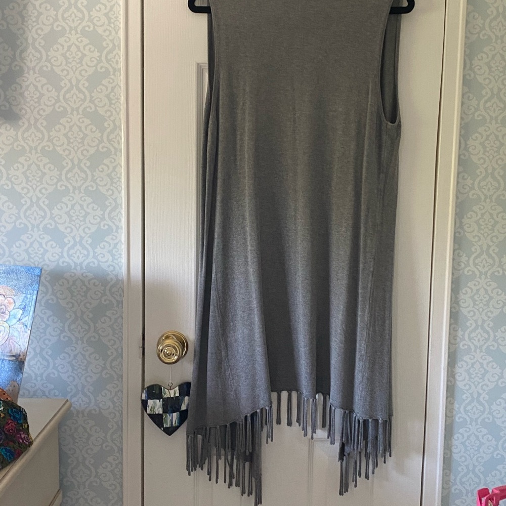 Stylish knit midi length vest with fringed hem! . Very good condition. Sz medium